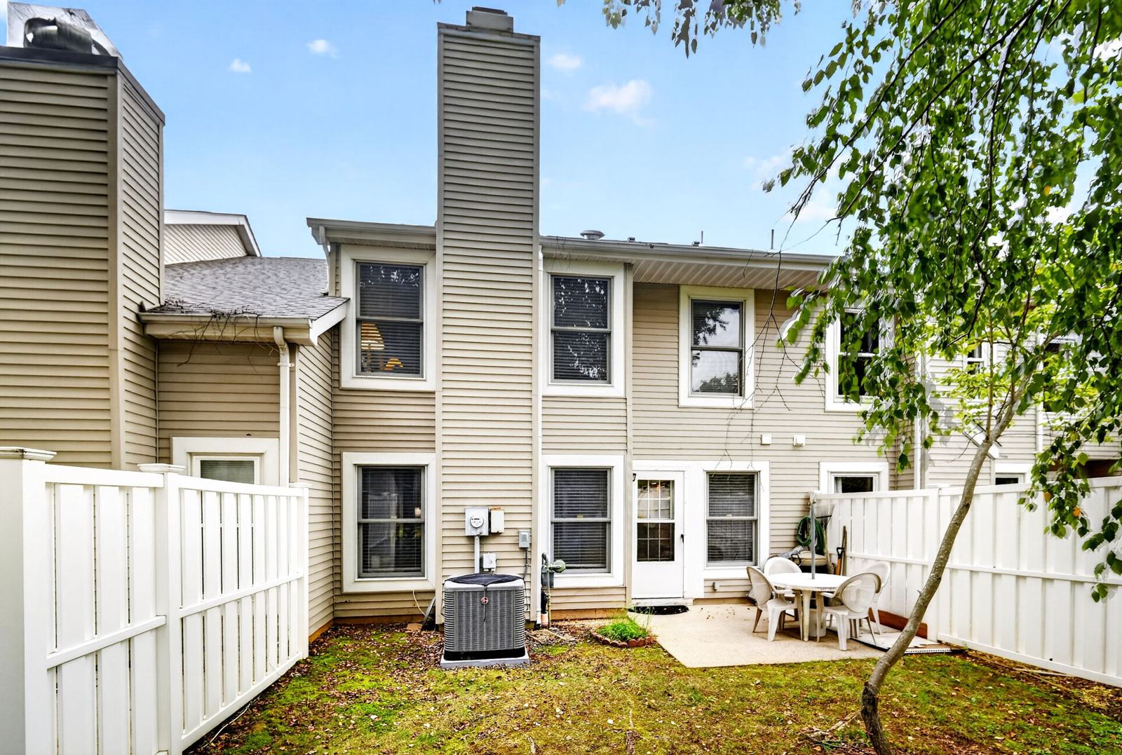 Private backyard with vinyl privacy fence and patio, and the central air unit installed in 2024